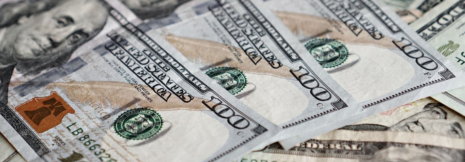 Close-up of a pile of US hundred-dollar bills